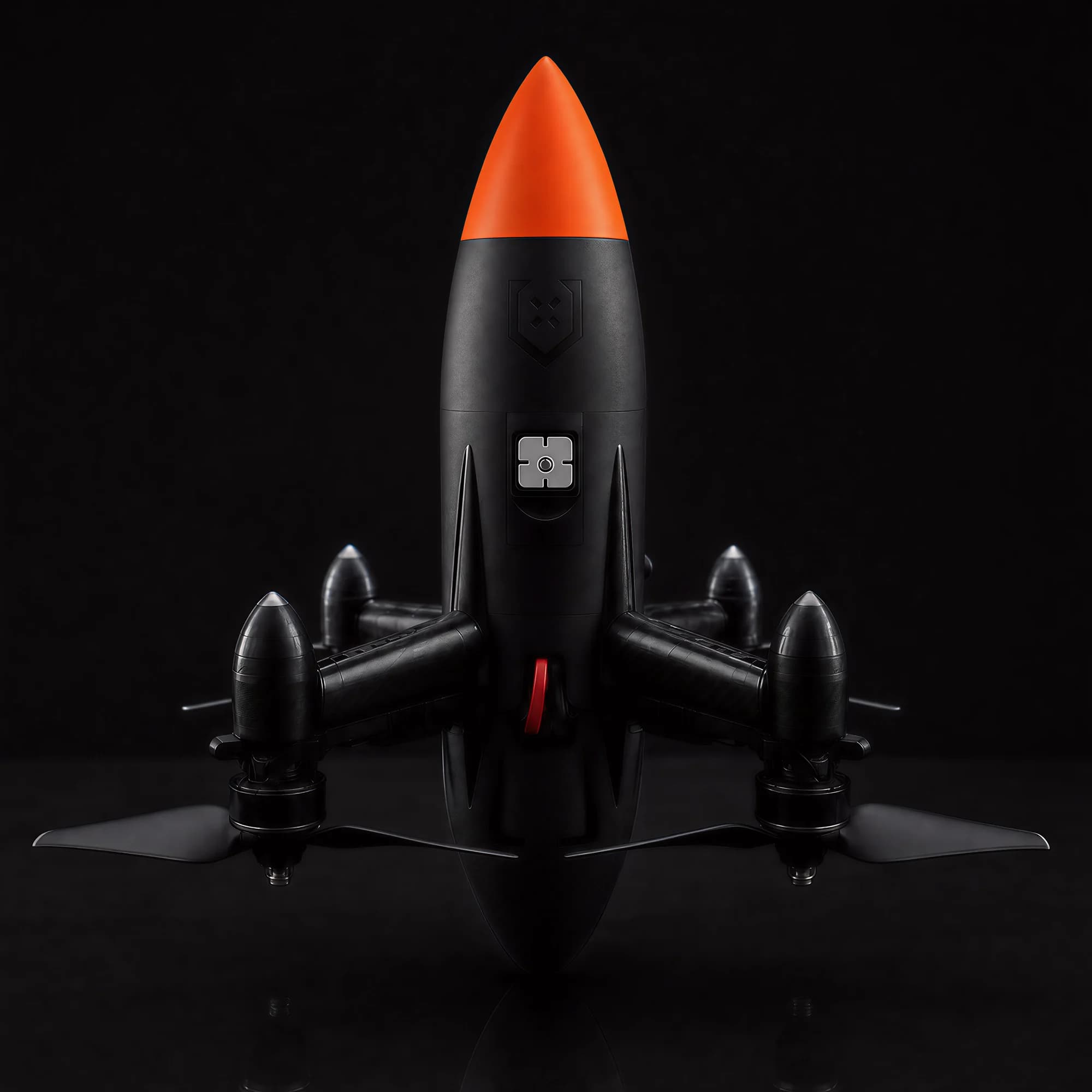 Unmanned Industries UI R50 counter-UAS interceptor, nose-up studio shot on a near-black background with an orange nose cone